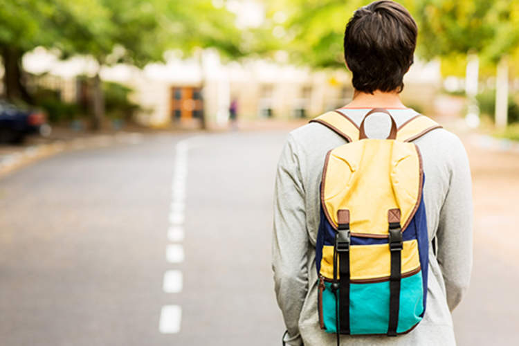 Teenager walking to school.