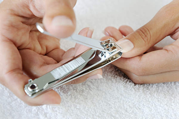 Using nail clippers.