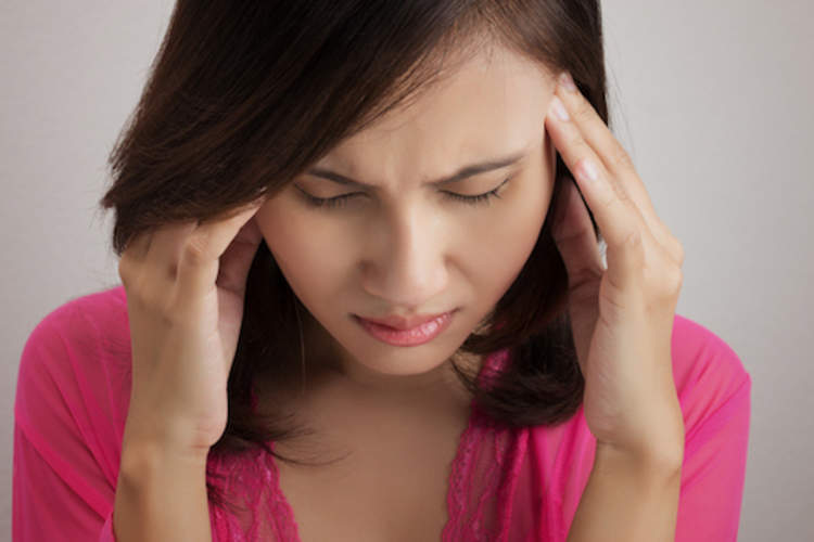 Woman with migraine