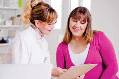 Smiling doctor and MS patient.