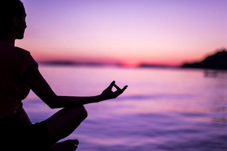 meditating at sunset.