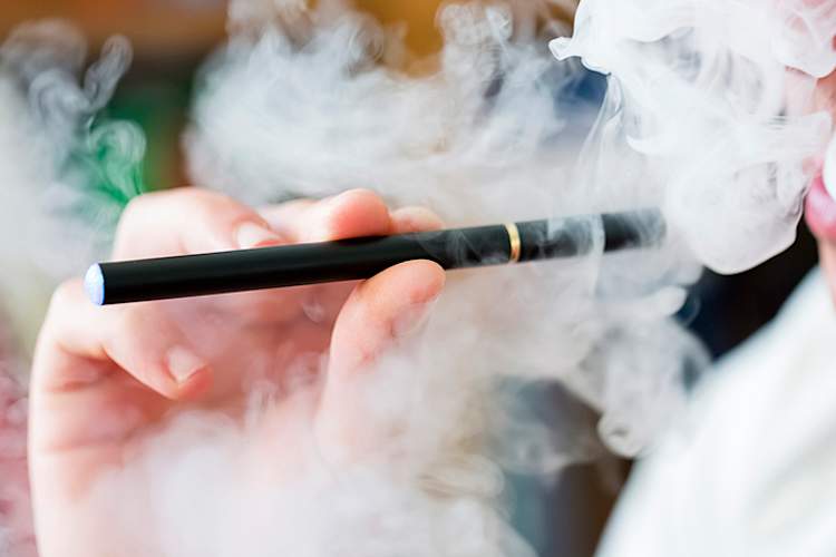 Man using an e-cigarette.