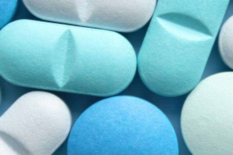 Assortment of blue and white pills.