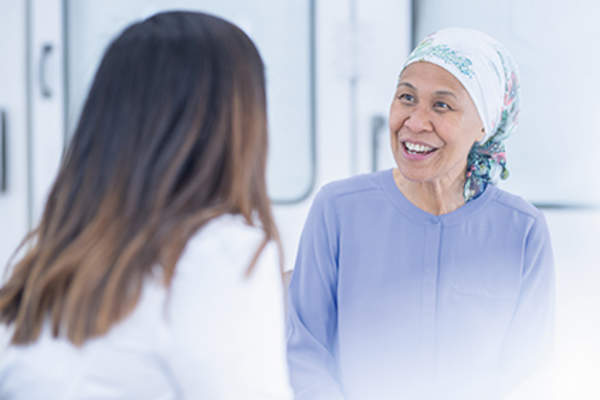 Cancer patient discussing recurrence prevention with her doctor.