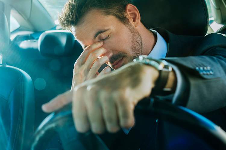 Man driving while drowsy.