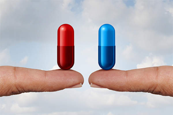 Red capsule on fingertip, blue capsule on fingertip.