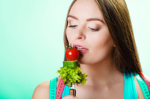 woman raw vegetables