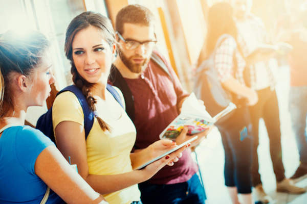 Students exchanging notes from class.