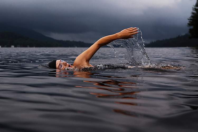 Woman swimming in lake