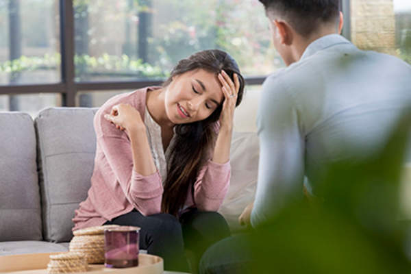 Woman discussing depression with a therapist.