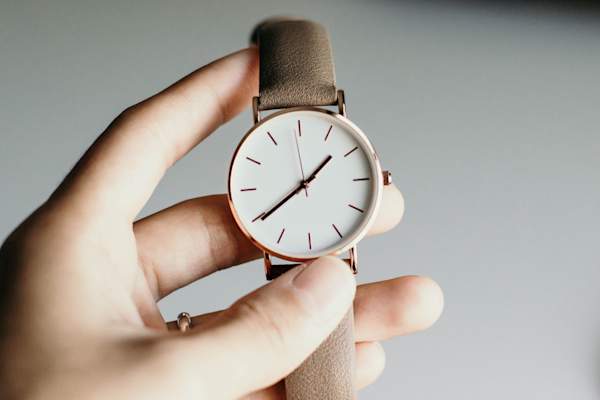hand holding watch