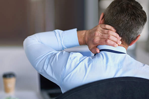 Man experiencing neck pain.