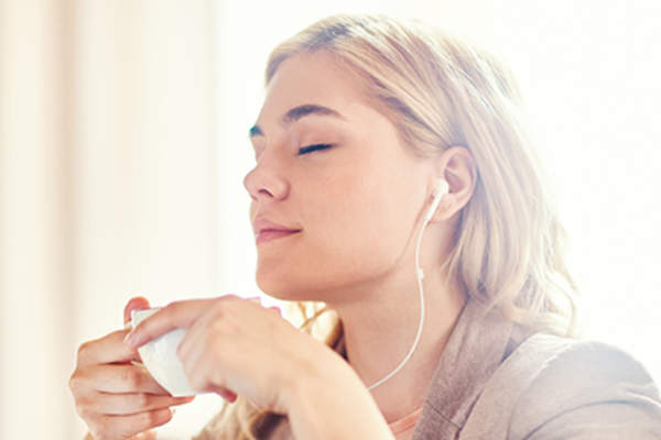 Woman listening to guided meditation