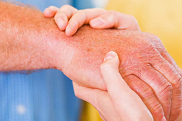 older man being examined for bruising