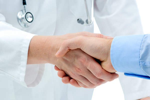 patient and doctor shaking hands image