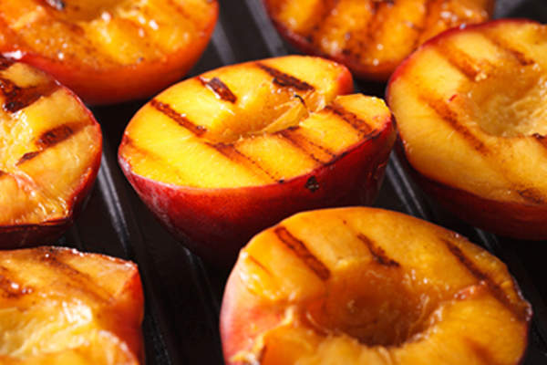 Fresh peaches on grill