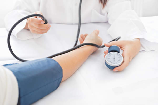 Monitoring patients blood pressure.