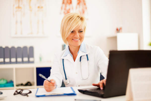 Doctor comparing test results.