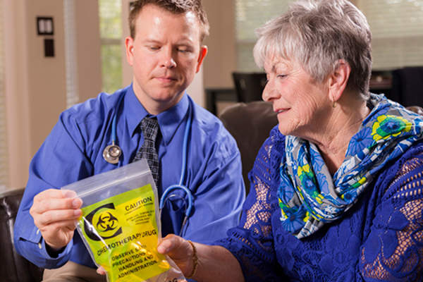 Woman and doctor discussing chemotherapy image.