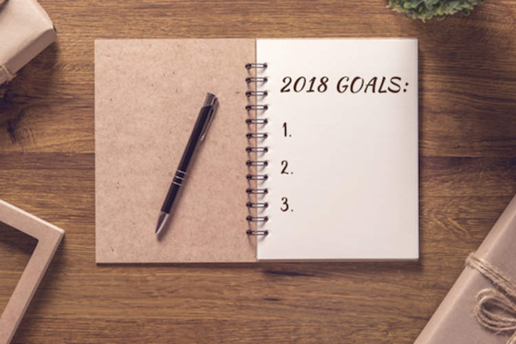 2018 goals notebook open on table.