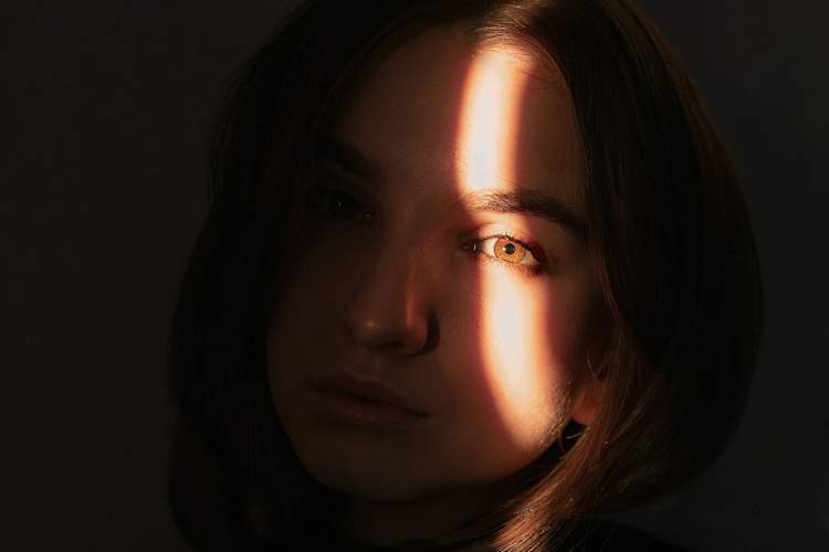 woman's face with light on one eye