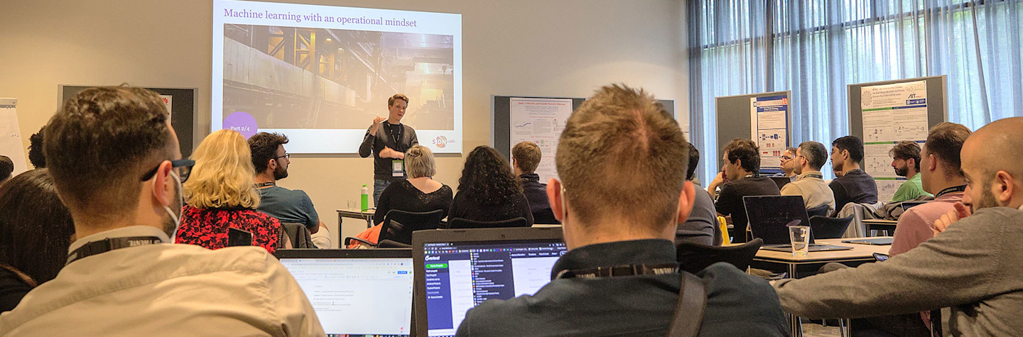 Thijs van den Hout presents during a workshop on operationalising machine learning models during TMA PhD School.