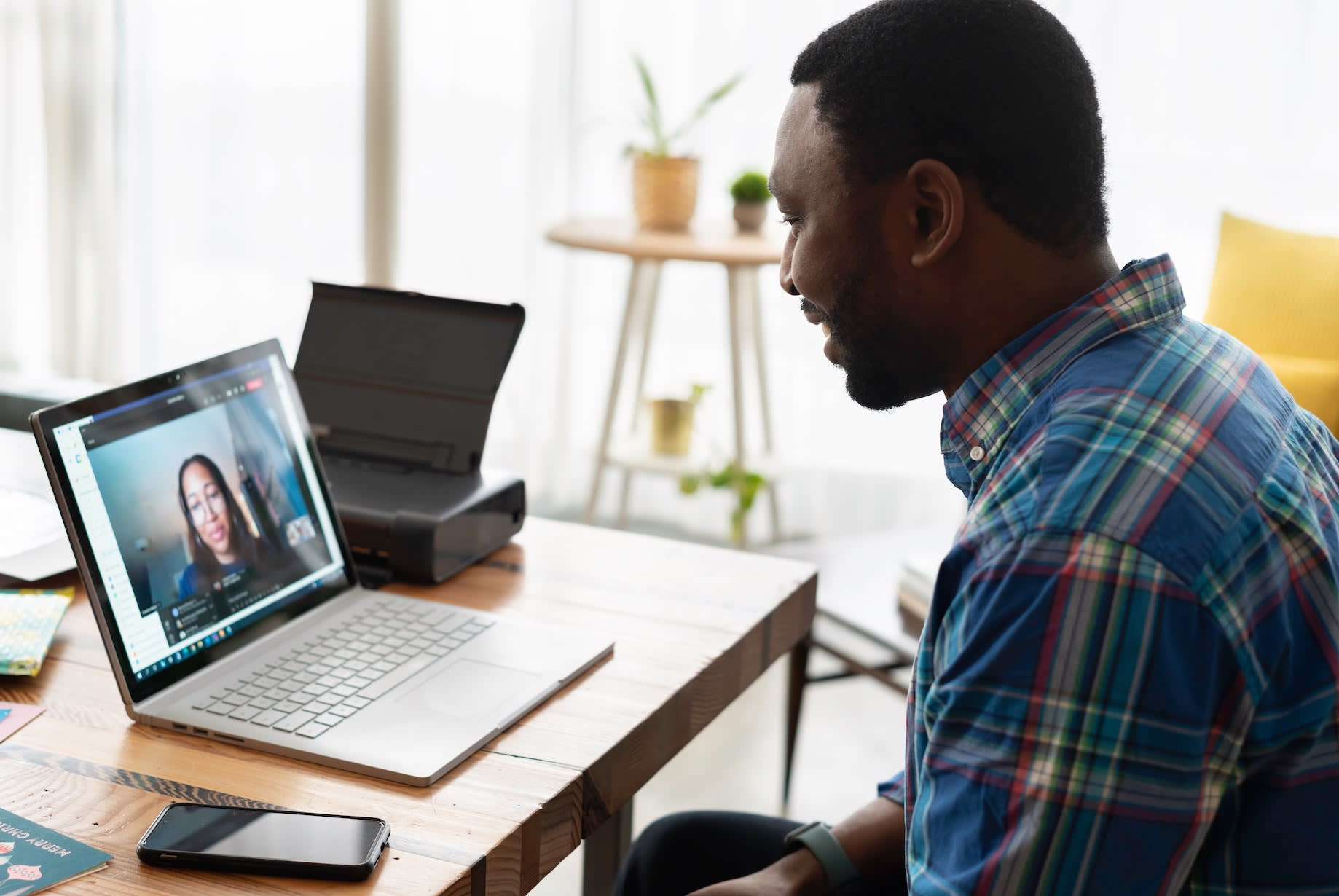 Two people chatting during an online interview.