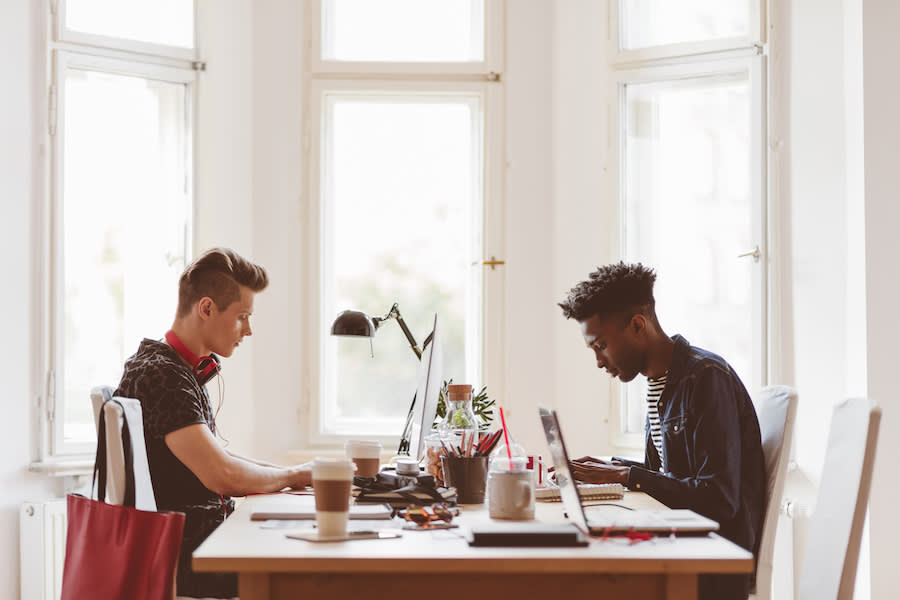 Two men on computers