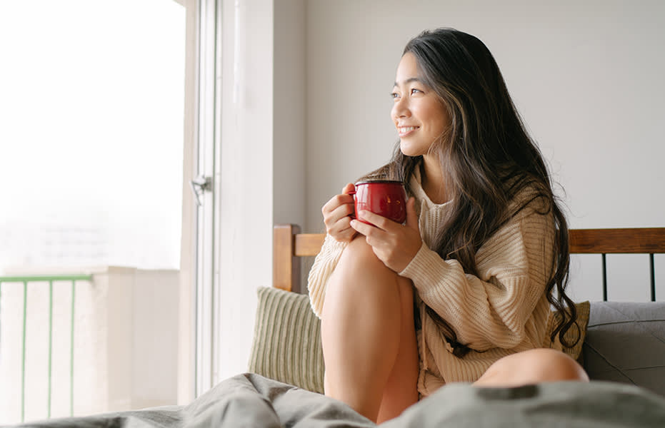 photo of a woman relaxed with a drink