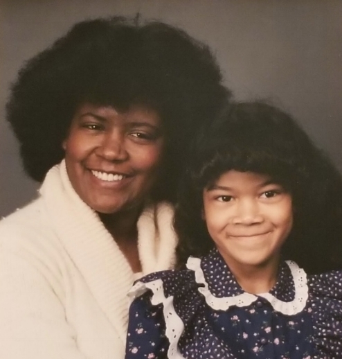Sheena as a child, alongside her mother