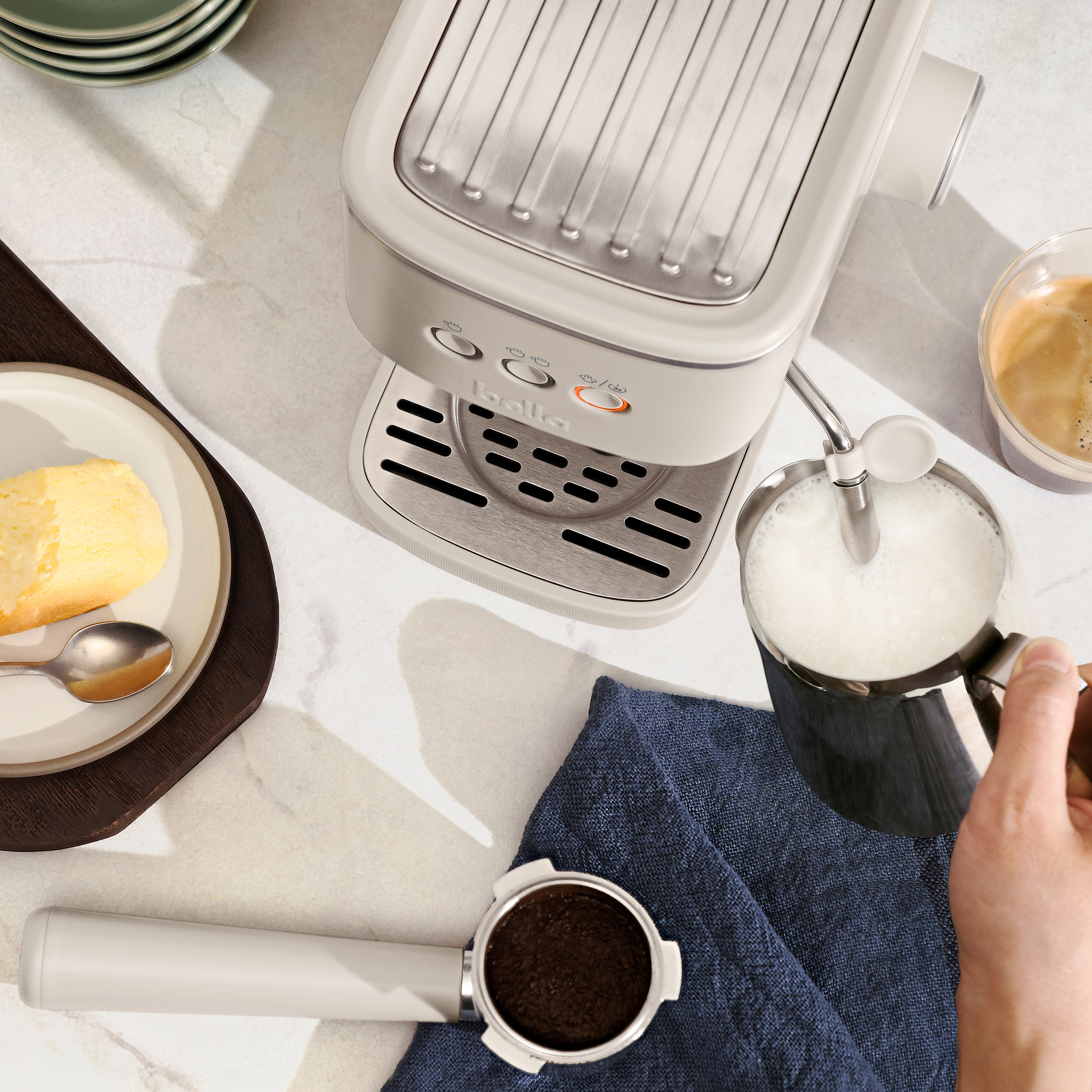 Overhead shot of espresso machine frothing milk.