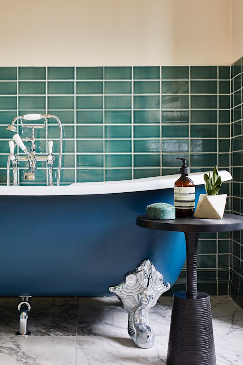 Blue and green bathroom design with roll top bath at a North London loft conversion by Islington interior designer Andrew Jonathan Design