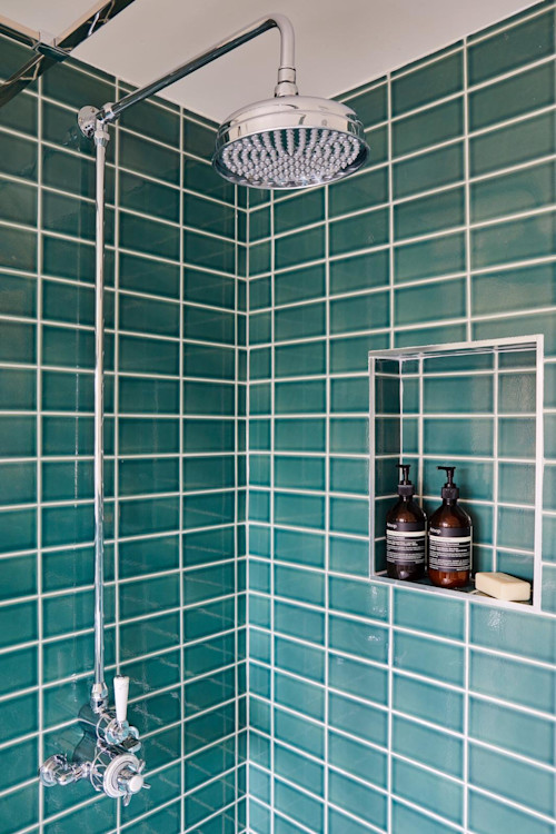 Tiled shower in loft conversion ensuite - teal green tiles and chrome fittings. North London Interior Design