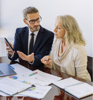 A woman viewing the different Life Insurance options with her agent.