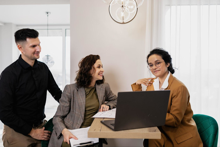 A couple renewing their Life Insurance with their Insurance Agent.