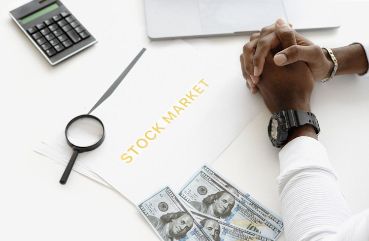A person looking at the stock market.