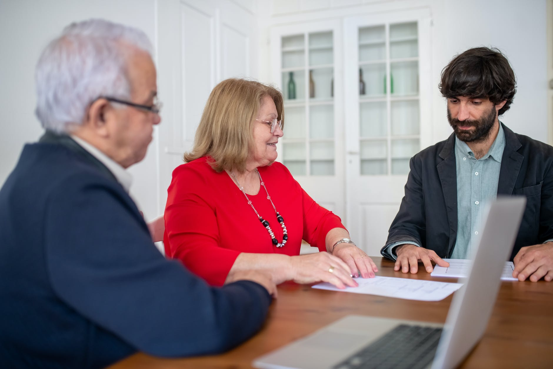 An older couple signing up for