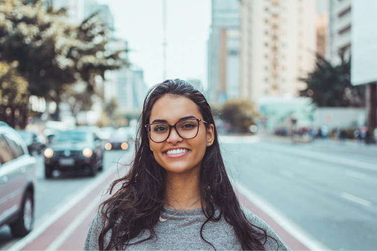 A woman that is happy because she found an insurance plan that is the best for her.