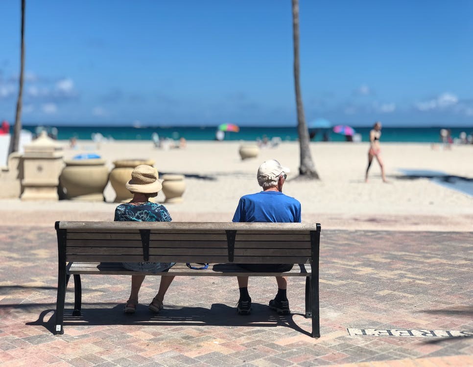 A happy elderly couple knowing their healthcare expenses would be partially covered when travelling outside of the U.S.