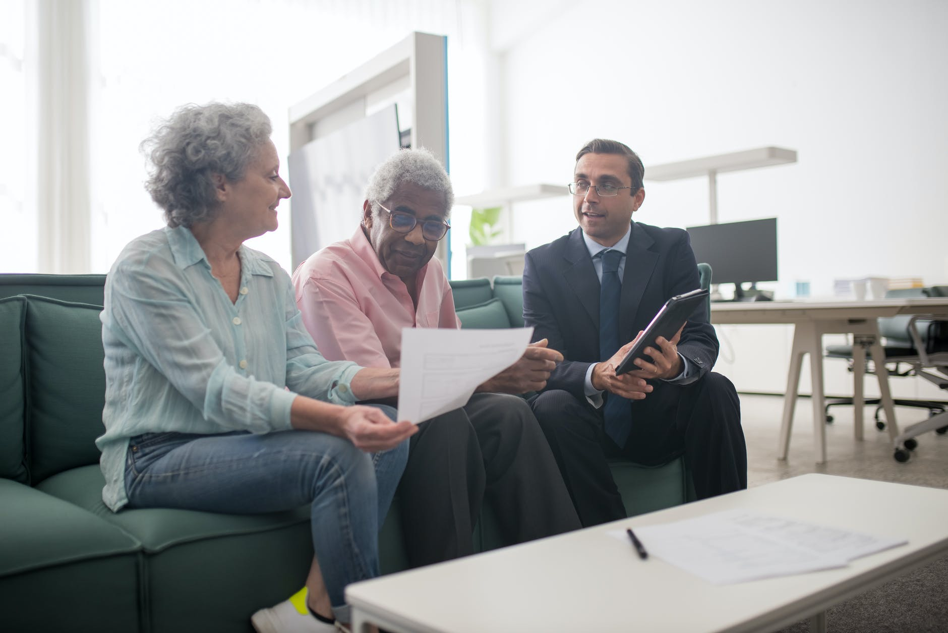 A senior couple signing up for Life Insurance.