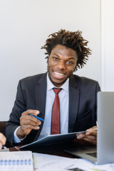 A man researching the cost he'll pay for Group Life Insurance.