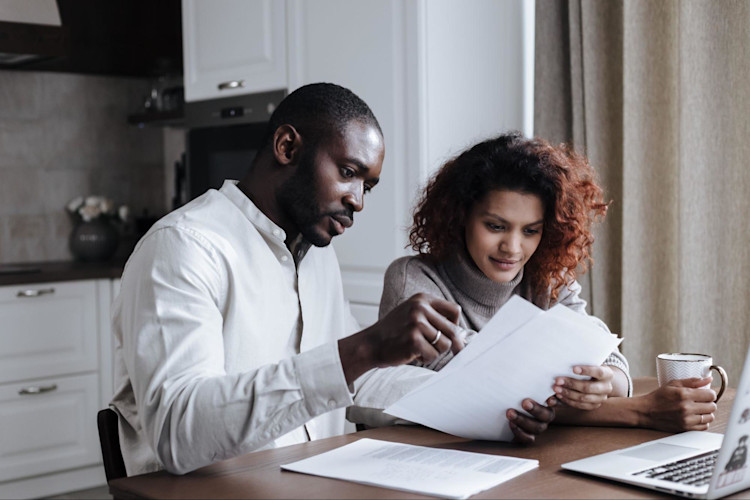 A couple who are reviewing their cash value for their Modified Whole Life Insurance policy.