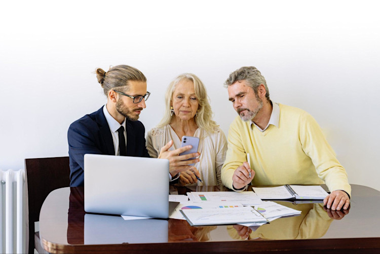 A couple signing up for Whole Life Insurance after their previous plan expired.