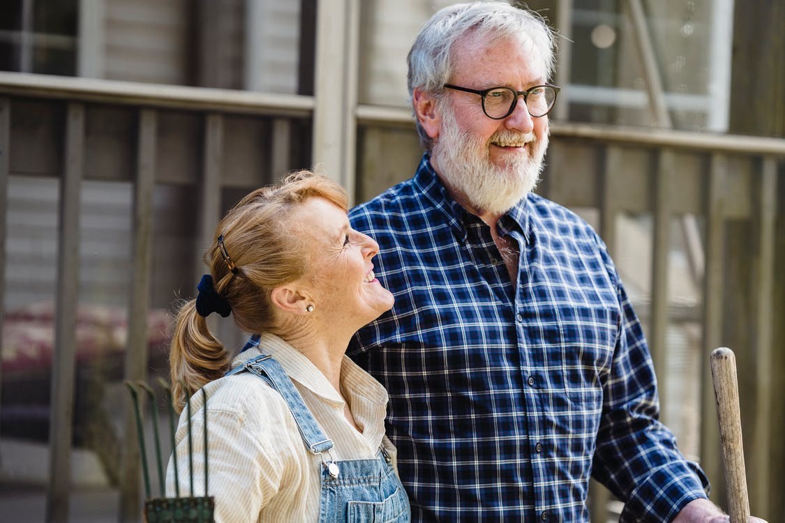 A man and a woman happy to know their doctor accepts Medicare.