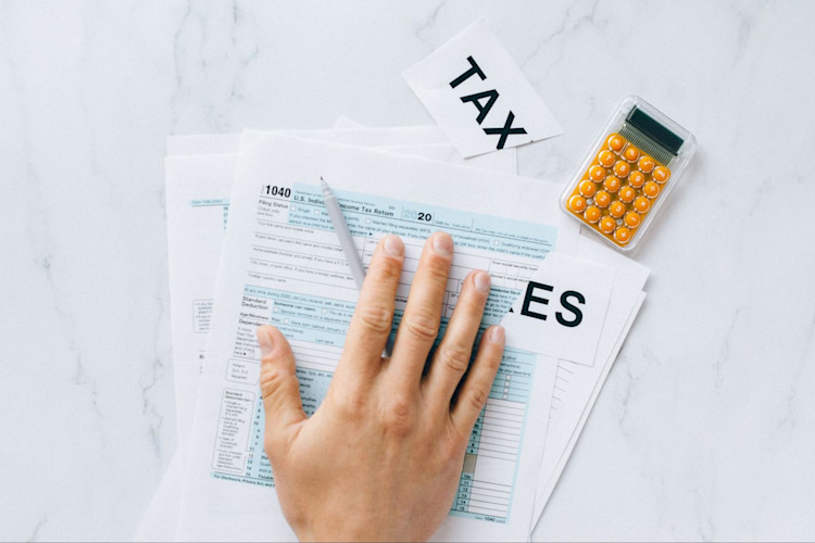 A person calculating how much of their cash surrender value will be deemed taxable income.
