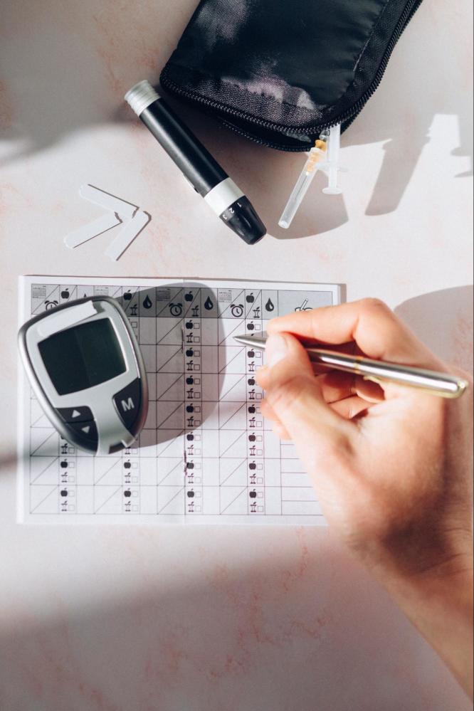 A person recording their blood sugar readings.