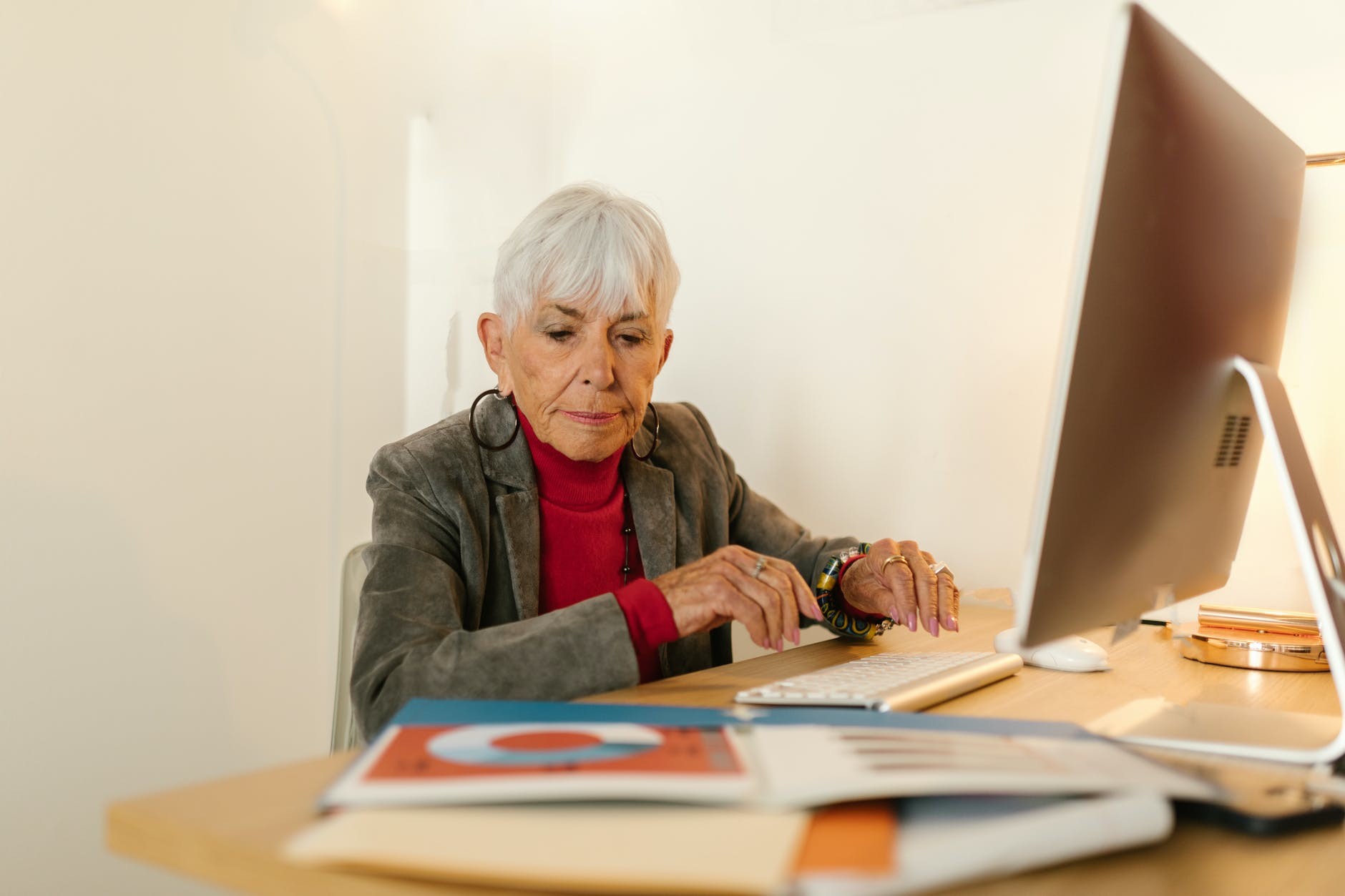 An elderly woman who is happy because she is eligible for Part A and B.