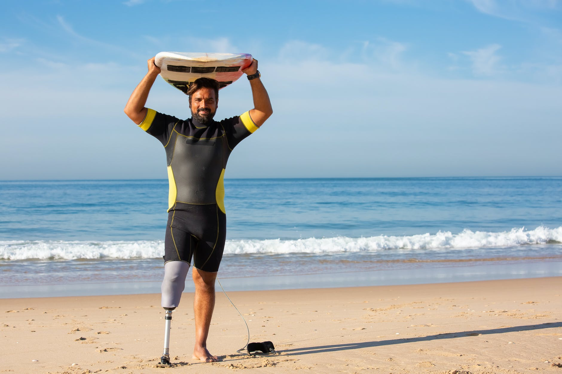 A man happy because he will be able to get Life Insurance even with his disability.