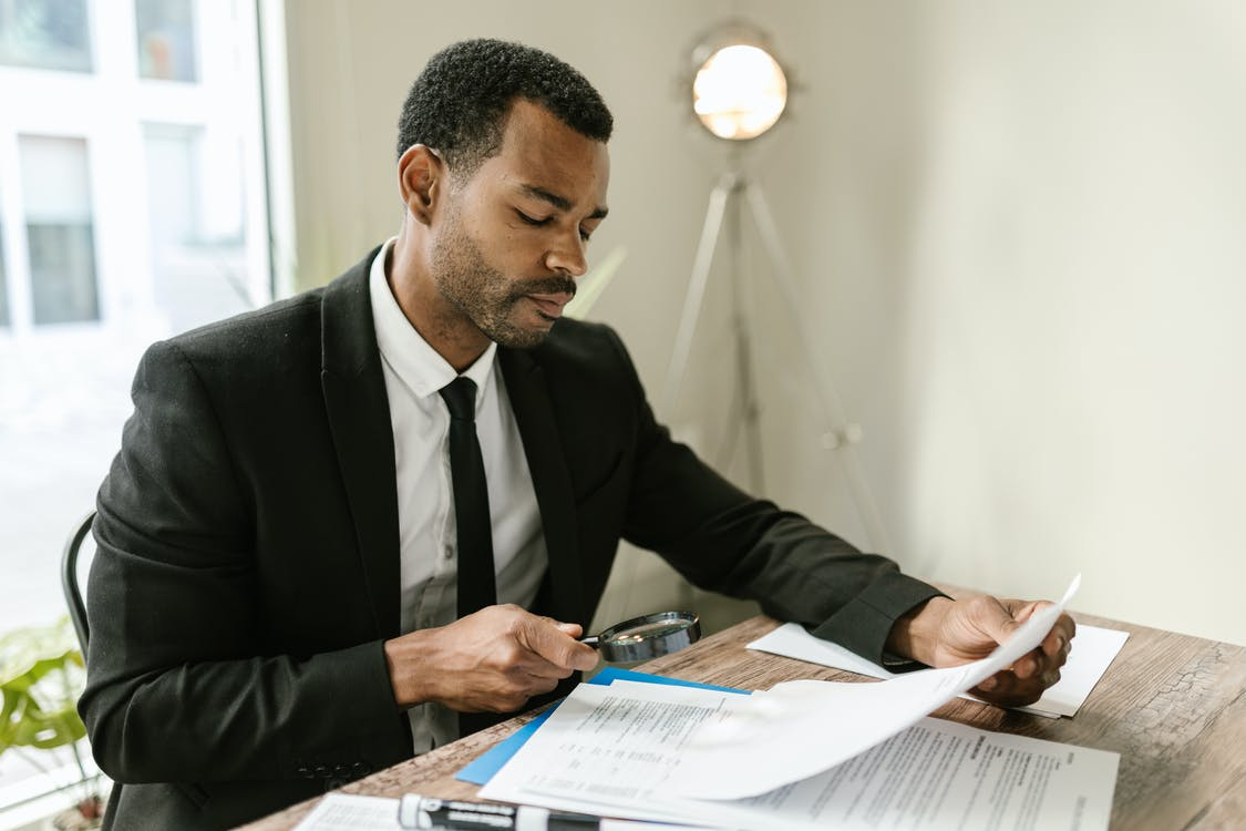 A man researching the difference between Renewable and Convertible Term Life Policies.