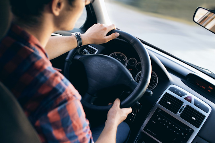 Person driving in a new vehicle protected by an auto policy